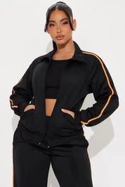Black zip-up jacket and wide-leg pants set with stripe detail
