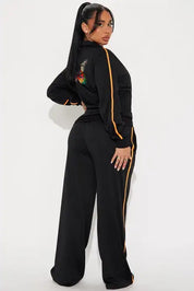 Black zip-up jacket and wide-leg pants set with stripe detail