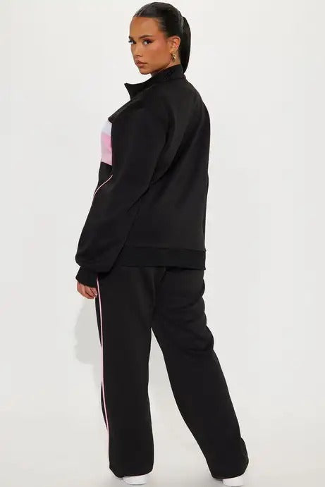 Black zip jacket and straight-leg pants set with pink panel