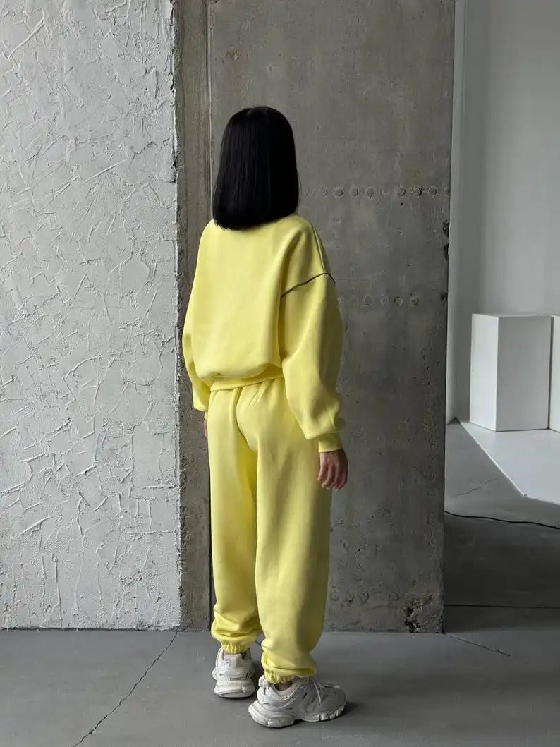Yellow zip-up sweatshirt and jogger set with contrast seams
