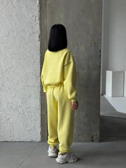 Yellow zip-up sweatshirt and jogger set with contrast seams
