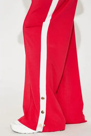 Red cropped zip jacket and wide-leg pants set with side stripe