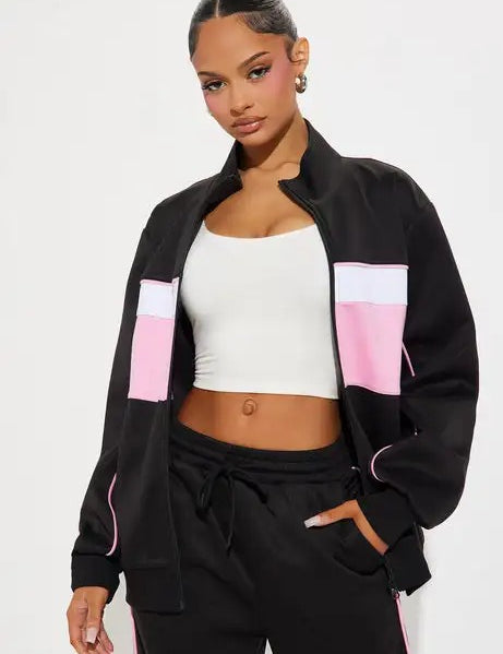 Black zip jacket and straight-leg pants set with pink panel