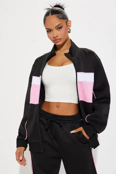Black zip jacket and straight-leg pants set with pink panel